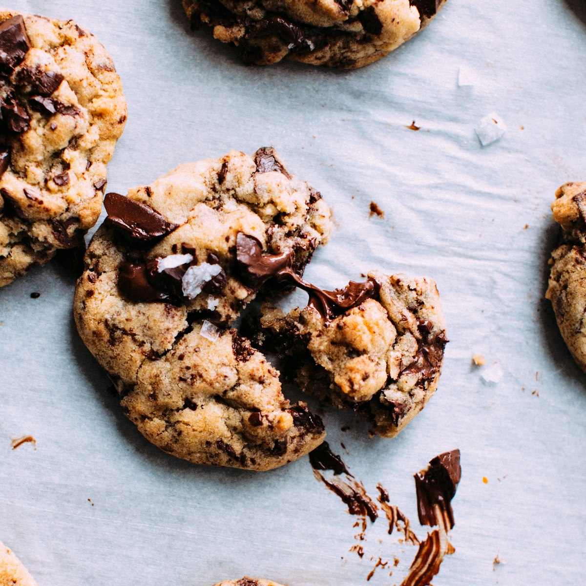 Chocolate chunk cookies broken open, still soft in the middle