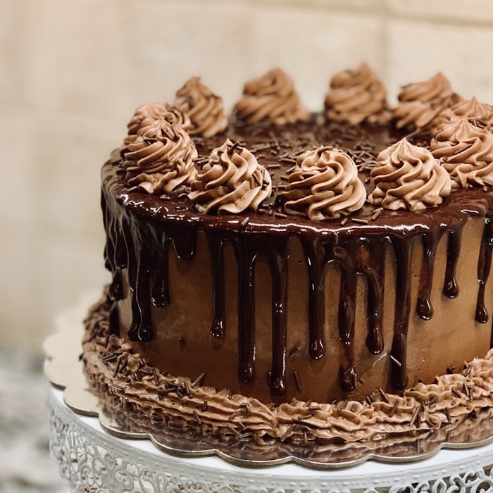 A tall chocolate cookie pie with chocolate dripping down the sides